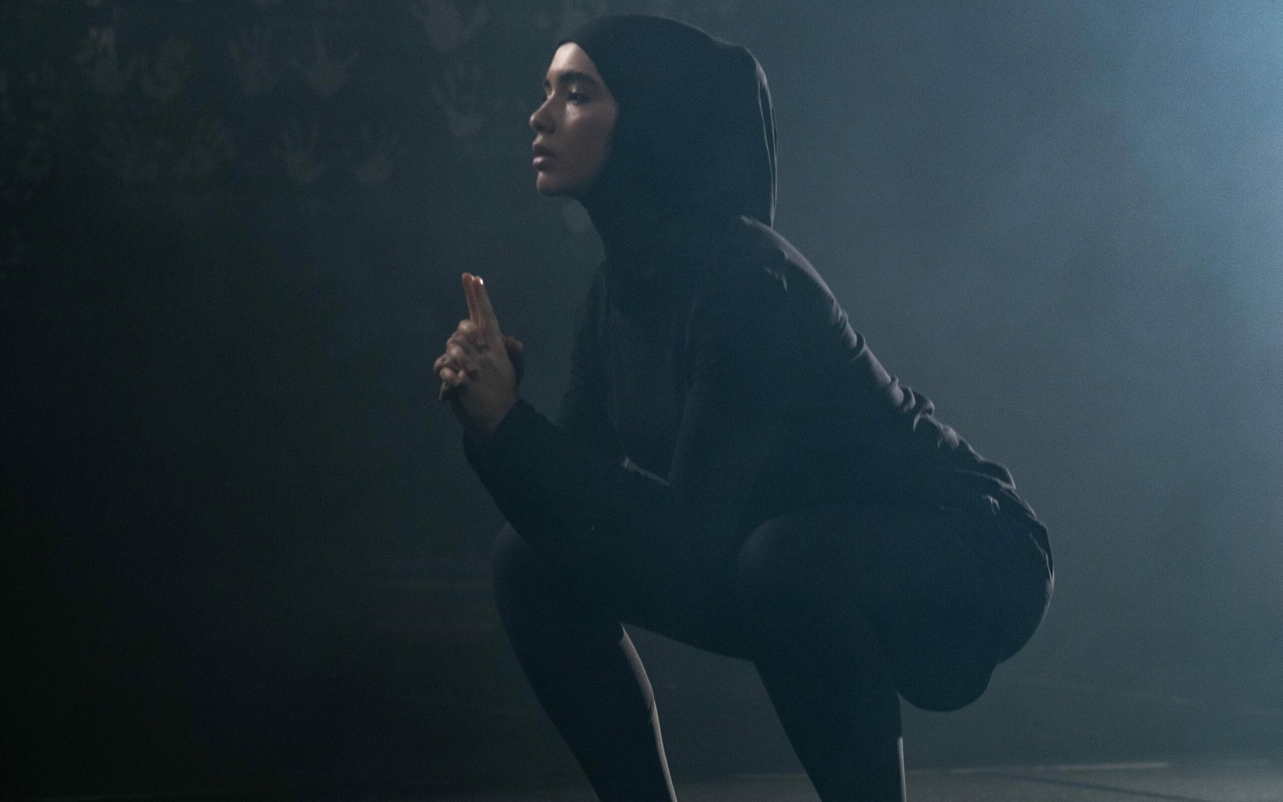 Woman does air squat